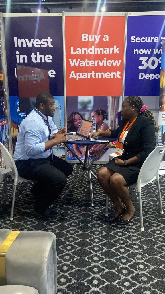 A meeting in progress at a property exhibitor stand during Hotel Expo Nigeria 2026 at the Landmark Event Centre, Lagos